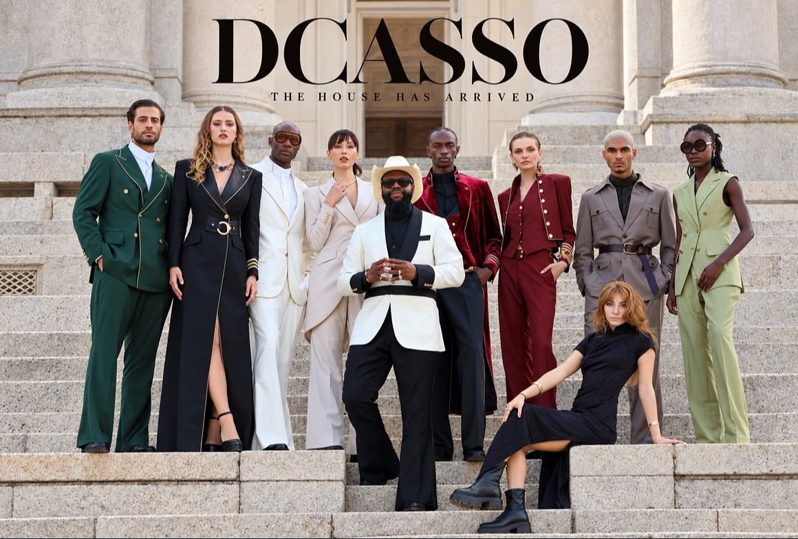 DCASSO campaign: The House Has Arrived, the full cast in the collection on stone steps with Isabella seated in front